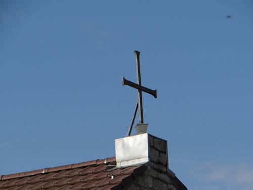 Bild Kreuz vor blauem Himmel